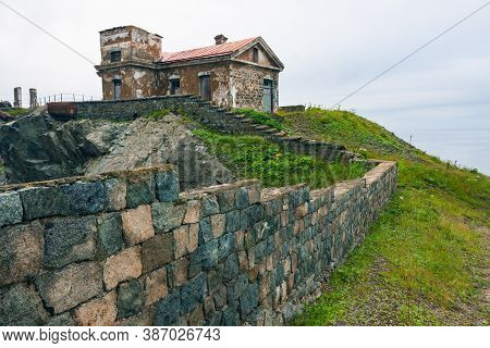 Huge Rocks On The Ocean, Sea Summer Landscape, Old Stone Building And Fence On A High Cliff, Gamova 