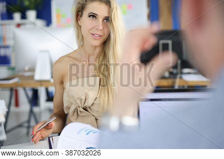 Businesswoman Sits At Table And Communicates With Colleague. Business Communication In The Office Co