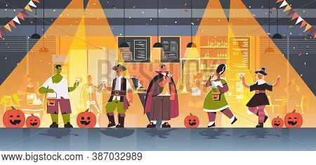 People In Different Costumes Celebrating Happy Halloween Holiday Mix Race Men Women Drinking Cocktai