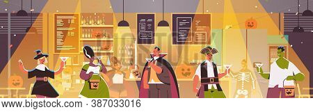 People In Different Costumes Celebrating Happy Halloween Holiday Mix Race Men Women Drinking Cocktai