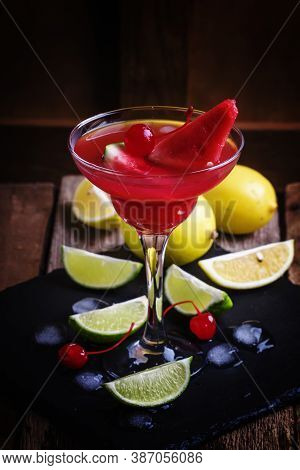 Alcoholic Cocktail With Watermelon, Lemon, Lime, Tequila And Ice, Black Background, Selective Focus