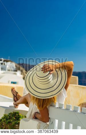 Woman on holidays in Santorini island in Greece