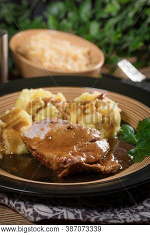 Braised Pork Neck In Own Sauce Served With Boiled Potatoes And Fried Cabbage. Shallow Depth Of Field