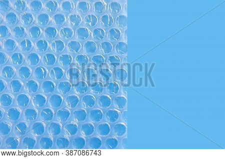 Bubble Wrap Packing Or Air Cushion Film On A Blue Background.