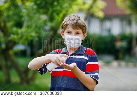 School Kid Boy With Medical Mask As Protection Against Pandemic Coronavirus Quarantine Disease. Chil
