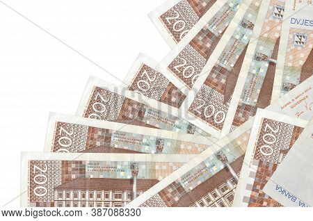 200 Croatian Kuna Bills Lies In Different Order Isolated On White. Local Banking Or Money Making Con