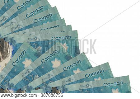 5 Canadian Dollars Bills Lies Isolated On White Background With Copy Space Stacked In Fan Close Up