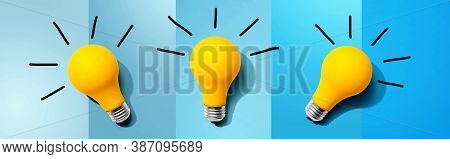 Three Yellow Light Bulbs - Flat Lay From Above