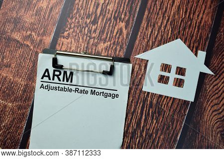 Arm - Adjustable-rate Mortgage Write On A Paperwork Isolated On Office Desk.