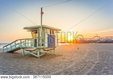 Sunset Over Famous Amusement Park With An Iconic Rescue Hut