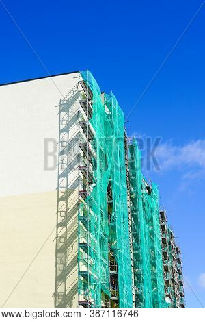 Scaffolding Arround The House To Install Thermal Insulation Of The Apartment Building Facade