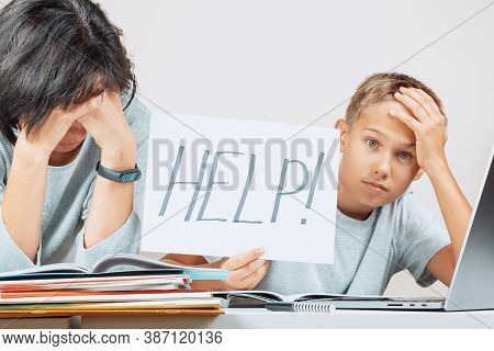 Learning Difficulties, Remote Education, Online Learning Concept. Tired Mother And Sad Kid Need Help