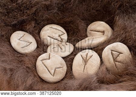 Stone Runes On A Animal Fur. Futhark Viking Alphabet. Close Up Photo Of Norse Runes.