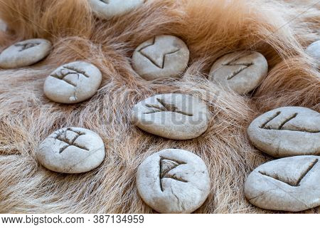 Stone Runes On A Animal Fur. Futhark Viking Alphabet. Close Up Photo Of Norse Runes.