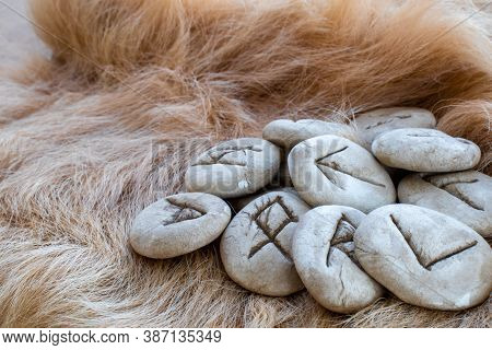 Stone Runes On A Animal Fur. Futhark Viking Alphabet. Close Up Photo Of Norse Runes.