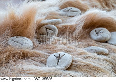 Stone Runes On A Animal Fur. Futhark Viking Alphabet. Close Up Photo Of Norse Runes.