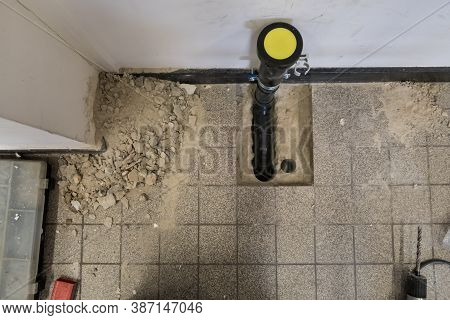 A Black Polypropylene Drain Pipe Worked Into The Floor