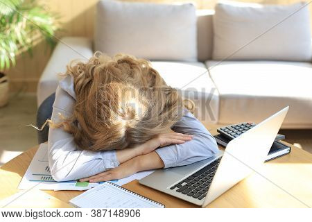 Tired Overworked Woman Resting While She Was Working On Laptop.