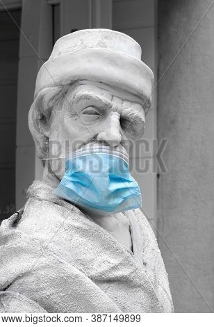 Sibenik, Croatia - September 24, 2020: Statue with protective surgery mask, szmbol of SARS-COV 19 protection 