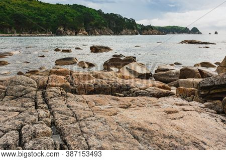 Rocky Seashore, Cloudy Weather At Sea, Coastline Of Telyakovsky Bay Primorsky Krai, Russia.