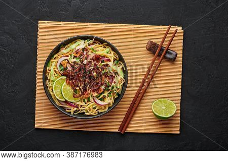 Burmese Atho In Black Bowl On Dark Slate Table Top. Atho Is Myanmar Indian Cuisine Dish Popular In C
