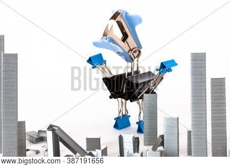 staple remover and staples on white background concept