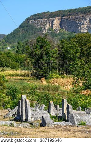 Vadul Rascov, Soldanesti, Moldova, September 2020: Old ruined tombstones at the ancient Jewish cemetery, now abandoned. Jewish communuty was massacred by nazis during WW2.