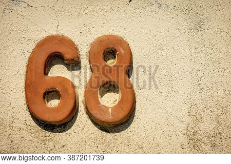 Close-up Of House Number 68 (sixty-eight) On A Stone Wall In The Small Village Of Tellaro. Liguria, 