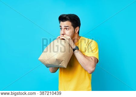 Young Handsome Man Having A Panic Attack On Blue Background