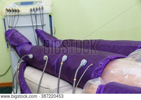 Pressotherapy In The Spa Salon For The Beauty And Health Of The Legs. A Procedure For Treating Legs 