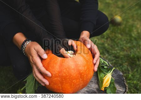 Daughter And Father Hands Carving Pumpkin For Halloween, Prepares Jack Olantern