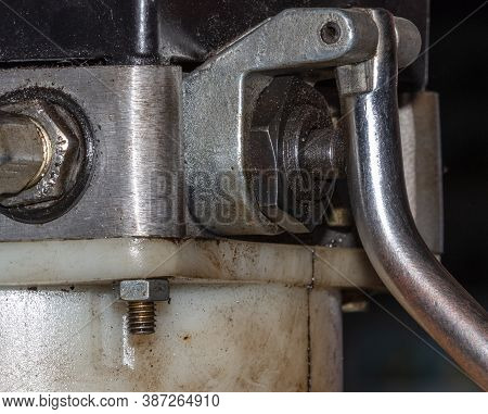 Closeup Photo Of Hydraulic Control Valve On The Side Of The Car Lifting Valve Stem