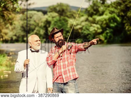 Friends Fishing. Elegant Bearded Man And Brutal Hipster Fishing. Perfect Weekend. Hobby And Recreati