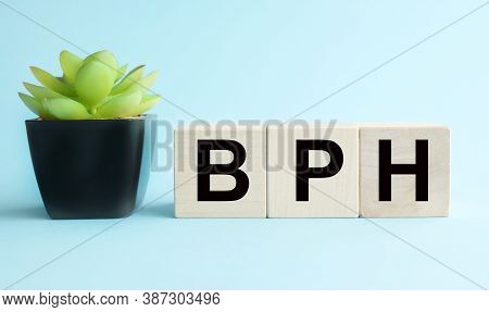 Bph Benign Prostatic Hyperplasia. Text On Wood Cubes On A Blue Background