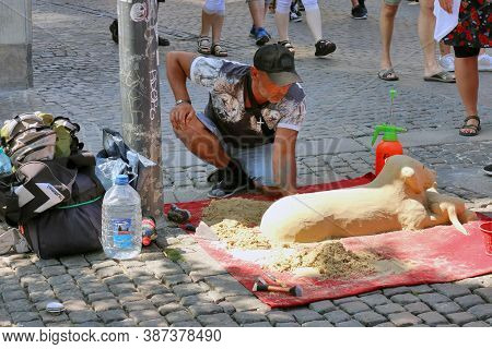 Copenhagen, Denmark - July 21: This Street Performer Sells His Artistic Creativity From Sand And Wat