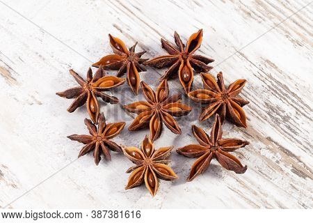 Some Star Anise Fruits On A Wooden Board, Close Up