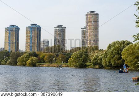 Houses In Strogino On The Background Of The River, Moscow.
