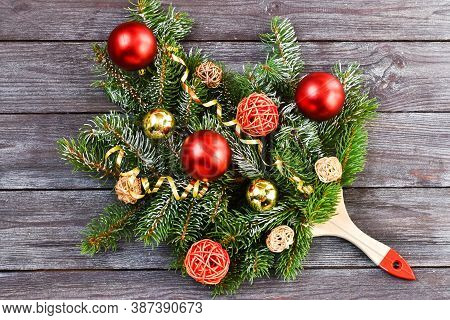 Creative Composition Christmas And New Year. Paint Brush With Christmas Fir And Ornaments On A Woode