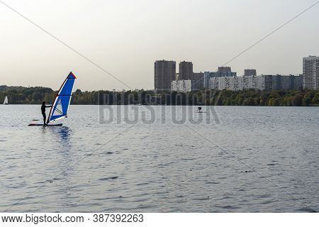 Standup Paddleboarding Are On The River Moscow, Strogino.