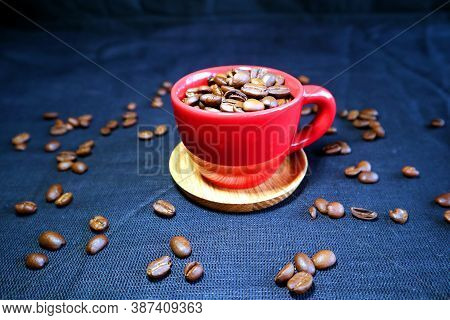 Red Ceramic Espresso Cup With Coffee Beans