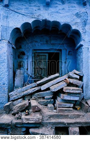 Blue house facade in streets of of Jodhpur, also known as Blue City due to the vivid blue-painted Brahmin houses, Jodhpur, Rajasthan, India