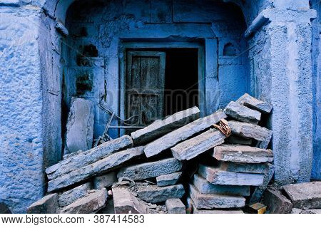Blue house facade in streets of of Jodhpur, also known as Blue City due to the vivid blue-painted Brahmin houses, Jodhpur, Rajasthan, India