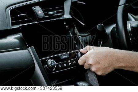 Man Turning On Car Air Conditioning System. Hand Of Man Turning On Car Air Conditioning System,butto