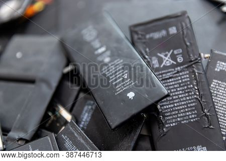 Russia - July 27, 2020: Broken Iphone Apple Phone Used Rechargeable Batteries In Recycling Chip Repa