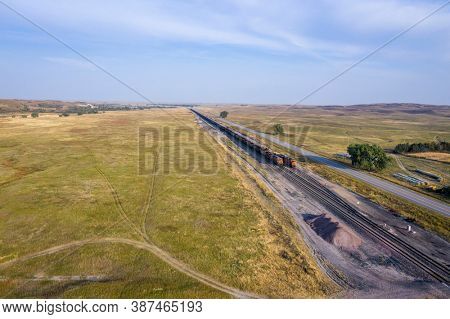 highway and coal freight trains in Nebraska Sandhills along the Middle Loup River, aerial view