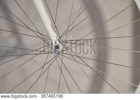 Bicycle wheel closeup front axle hub and fork