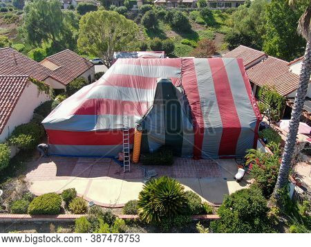 Aerial View Of Villa Covered With A Red And Green Tent While Being Fumigated For Termites, Rancho Be