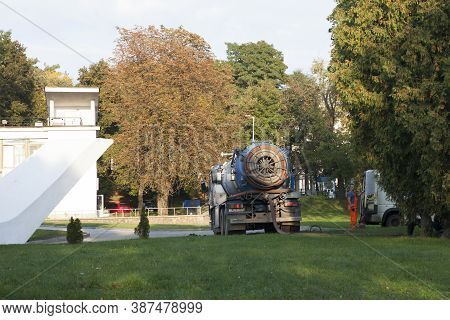 Blue Industrial Vacuum Trucks, Cesspool Machine In The Park. Back View. Minsk, Belarus. 09/25/2020.