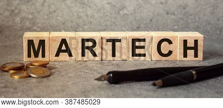 Finance, Inscription On Cubes, Word Martech On Cubes Of Wooden Texture.