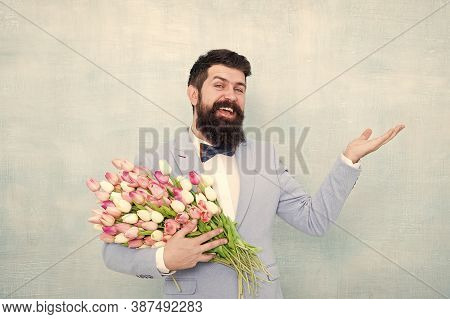 Flower Bouquet For Womens Day. Bearded Man With Tulips. Flowers Shop. Ideas To Celebrate Without Bre